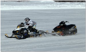 Photo courtesy of Michael Golub. UAF electrical engineering student and SAE Zero Emissions team co-captain Isaac Thompson drives the team's electric snowmachine during the acceleration event at the 2012 SAE Clean Snowmobile Challenge held in Houghton, Mich. March 5-9.