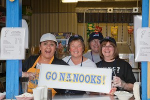 UAF photo. Staff members from Wood Center volunteer at the UAF Alumni Association's hamburger booth at the Tanana Valley Fair.