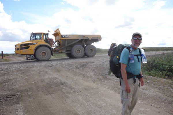 Photo by Ned Rozell. Eric Troyer hikes with Ned Rozell along the path of the trans-Alaska oil pipeline.