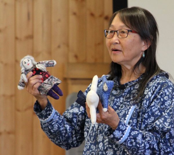 Photo by Yuri Bult-Ito. Rebecca Atchak of Stebbins demonstrates doll making while introducing Yup'ik terms and stories as part of UAF's REACH Up program.