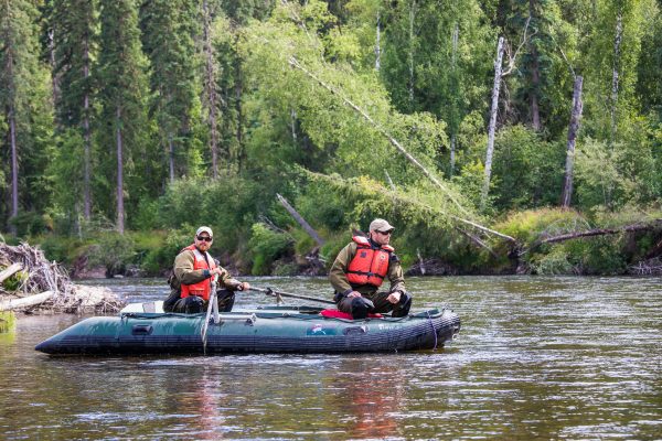UAF photo by JR Ancheta.  Research technicians Brian Crabill and Nate Cathcart float down the Chena River.
