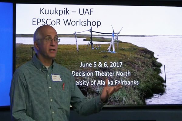 Alaska EPSCoR photo by Tom Moran.  Gary Kofinas, head of the Alaska NSF EPSCoR Northern Test Case, talks with members of the Kuukpik Corp. board of directors during the Kuukpik–EPSCoR workshop in June.
