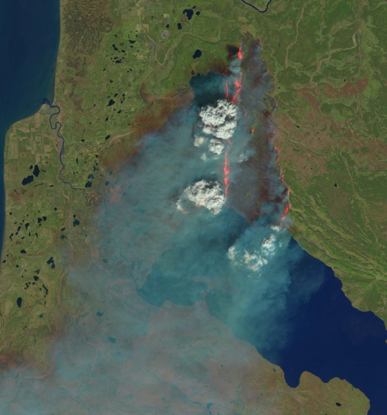 Photo courtesy of U.S. Geological Survey/NASA/Landsat.  UAF researchers collaborated with a composer to meld original music with remotely sensed imagery of wildfires, such as this example from the 2014 Funny River Fire burning north of Tustamena Lake on the Kenai Peninsula. They presented the multimedia work at the American Geophysical Fall Meeting on Dec. 12.