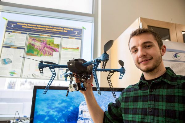 Photo by Meghan Murphy. University of Alaska Fairbanks undergraduate student Reyce Bogardus holds a 3D Robotics quadcopter, an unmanned aerial vehicle, at the 2017 Careers of Science and Math Opportunity Summit. Bogardus used a UAV to make a flood scenario map for a village in Alaska.