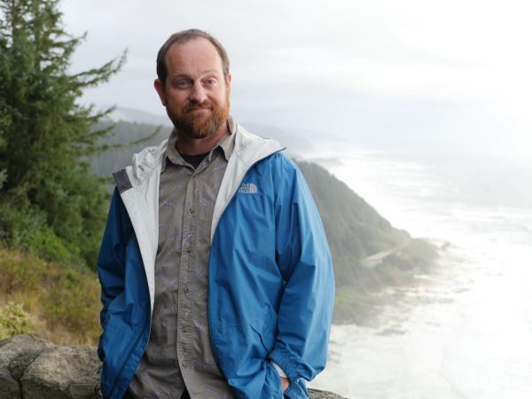 Photo courtesy of Scott Heppell.  Scott Heppell visits Cape Perpetua on the Oregon coast during an outreach trip with Oregon Sea Grant.