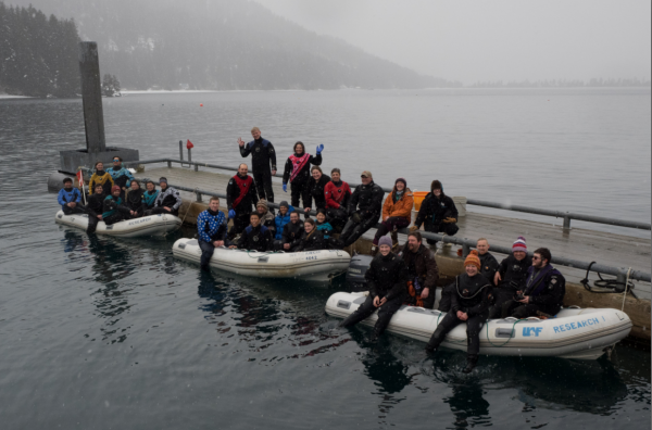 Photo by Brenda Konar.  Students in the 2018 scientific diving course load into small boats to head out into Kasitsna Bay.