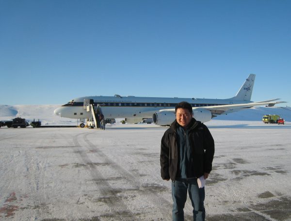 Photo courtesy of Jingqiu Mao. Kiersten Johnson's mentor, UAF chemistry professor Jingqiu Mao, prepares to sample the Arctic air in a NASA DC-8 aircraft.