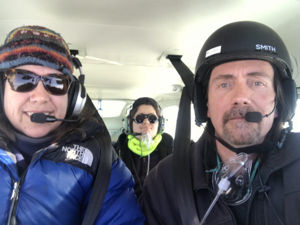 Photo by Matt Nolan.  From left, Kristen Scott, Turner Nolan and Matt Nolan fly in a Cessna 206 on their mapping mission over Denali.
