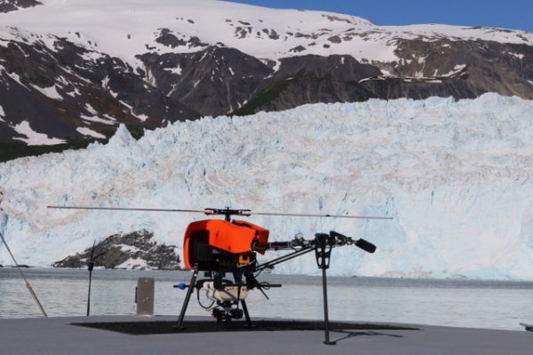 Photo courtesy ACUASI.  A Responder unmanned helicopter, owned by the Alaska Center for Unmanned Aircraft Systems Integration, sits near a glacier. ACUASI, part of the University of Alaska Fairbanks Geophysical Institute, will participate in a new federal program to help merge drones into the nation's airspace.
