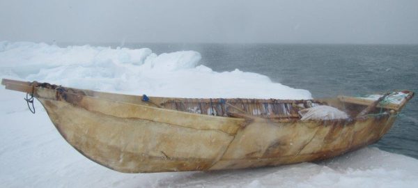Photo by Billy Adams, Alaska Arctic Observatory and Knowledge Hub. A boat used to hunt bowhead whales, a critical traditional resource, rests on the ice near Utqiaġvik, Alaska.