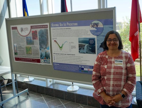 Photo by Josh Hartman. Uma Bhatt showcases her sea-ice work in May at the UAF Arctic Research Open House.