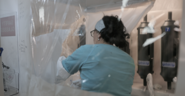 Microcosm Film photo.. Ana Aguilar-Islas works in her constructed clean-lab on Sikuliaq.
