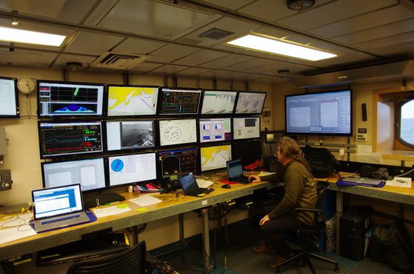 Hank Statscewich photo. Seth Danielson monitors incoming data from Sikuliaq's computer room.
