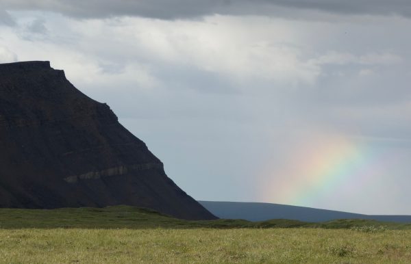 Photo by Ned Rozell. A rainbow forms in a rain shower near Slope Mountain in the Brooks Range.