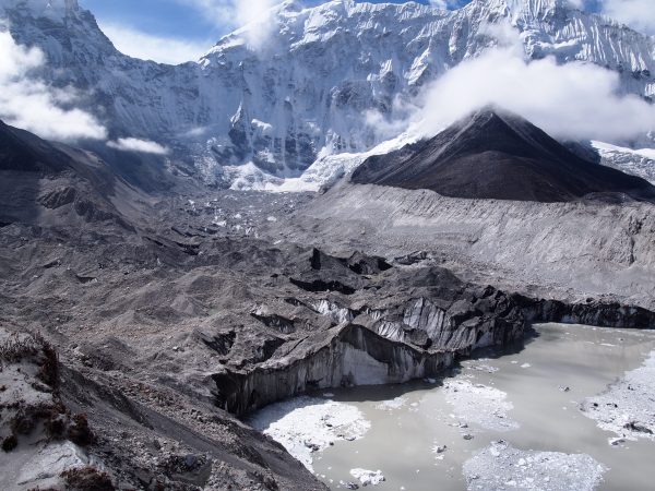 Photo by David Rounce. Ice calves into a melt pond from the face of Nepal's Imja-Lhotse Shar Glacier in June 2016.