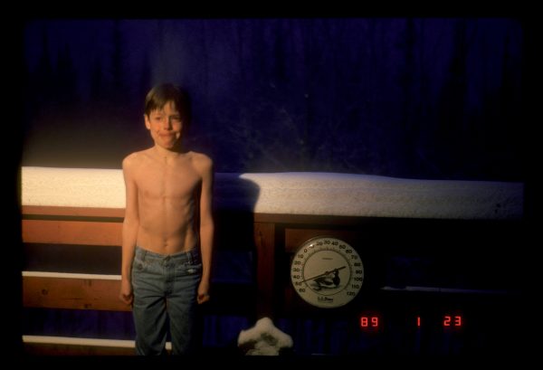 Photo by Walt Tape. Carl Tape, age 9, stands outside on his family’s Fairbanks deck at minus 50 degrees Fahrenheit on Jan. 23, 1989. “Carl was ahead of his time,” said climatologist Rick Thoman at the University of Alaska Fairbanks. “Now people pose in front of the UAF sign.”