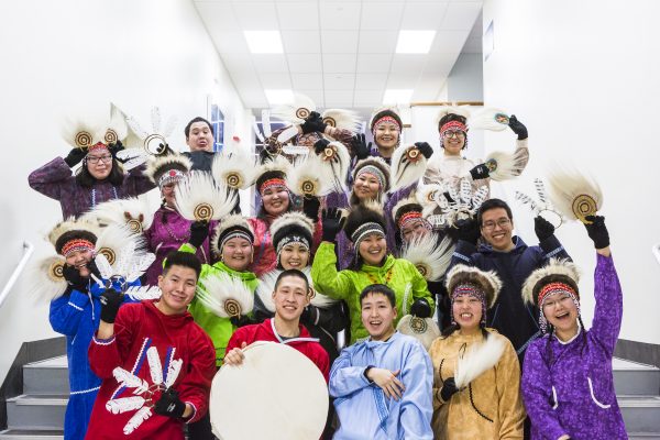 UAF photo by JR Ancheta. Kuskokwim Campus's Alaska Native dance group poses after their 2018 Festival of Native Arts performance. The 2019 Festival of Native Arts is dedicated to Mary Ciuniq Pete in remembrance of her unselfish service and the profound impact she had on UAF’s rural and Alaska Native students.