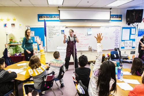 UAF photo by JR Ancheta. University of Alaska Fairbanks researchers Katie Spellman and Chris Arp interact with fourth-grade students at Anne Wien Elementary School on March 25, 2019, while testing Fresh Eyes on Ice school protocols.