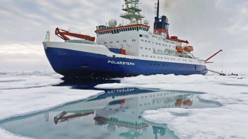 Photo by Alfred Wegener Institute/Mario Hoppmann. The German research icebreaker RV Polarstern will transport the MOSAiC expedition through the central Arctic Ocean as it drifts past the North Pole towards the Atlantic Ocean while trapped in sea ice.