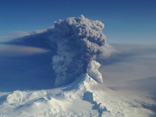 Photo courtesy of the U.S. Coast Guard. Pavlof Volcano on the Alaska Peninsula erupts in March 2016. The photo was taken from a Coast Guard HC-130H based in Kodiak and commanded by Lt. Commander Nahshon Almandmoss.