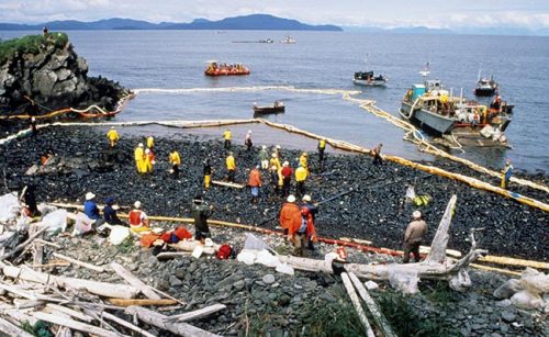 Public domain photo from the Exxon Valdez Oil Spill Alaska Resources Library and Information Services reference. Workers prepare for oil dispersant testing at Quayle Beach, Smith lsland (Prince William Sound), after the Exxon Valdez oil spill in 1989.