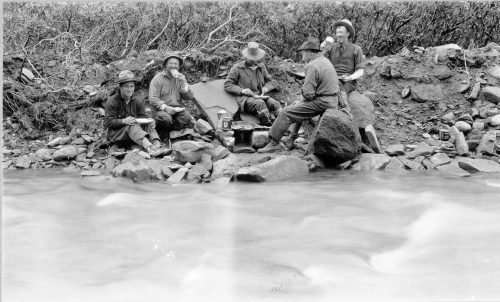 USGS photo by W.R. Smith. A U.S. Geological Survey field party cooks breakfast with natural gas from a seep on Gas Creek in the Alaska Peninsula’s Katmai region in 1922.