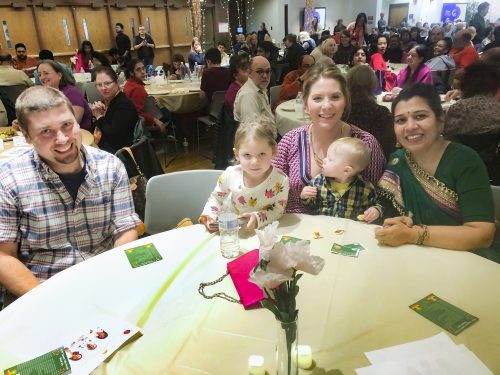 Julie Queen, second from right, attended Diwali in November 2019. She was joined by her husband, Travis, and their children Polly and Turner. Provost Anupma Prakash sat with the family to celebrate the Indian Festival of Lights. Photo courtesy of Julie Queen.