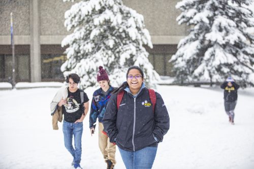 A snowstorm brought smiles to the face of students making their way across campus in November 2019. UAF photo by JR Ancheta.