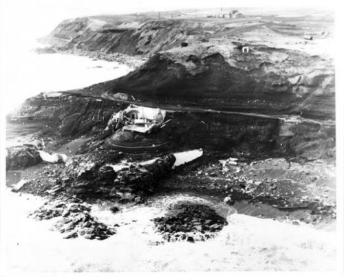 Photo courtesy NOAA's NCEI, Coast Guard. The remains of the Scotch Cap Lighthouse lie crumpled on a bluff on Unimak Island after the April 1, 1946, tsunami.