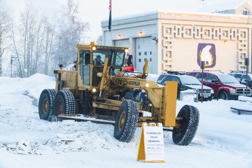 A member of the Facilities Services operations crew removes snow along North Chandalar Drive on Jan. 11, 2019. UAF photo by JR Ancheta.