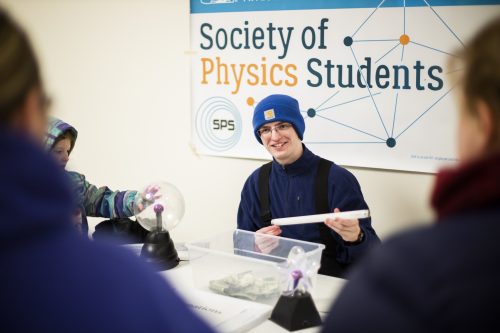 Evans Callis, chapter president of the UAF Society of Physics Students, explains the principles of physics during an Astropalooza outreach event. UAF photo by JR Ancheta.