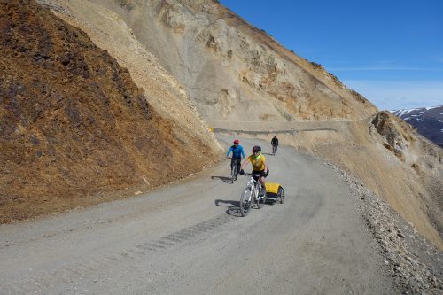 Photo by Ned Rozell. Cyclists ride on an unstable portion of the 92-mile gravel road within Denali National Park.