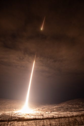 NASA photo by Chris Perry. A NASA sounding rocket's first and second stages fire as it climbs from Poker Flat Research Range on Jan. 27, 2020.