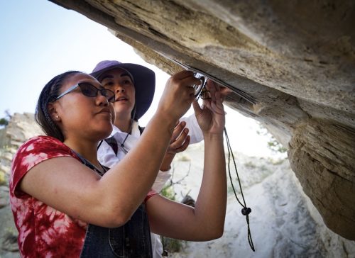 Photo by Leif Van Cise. Rachael Solomon of Utqiaġvik, at left, works with industry mentor Veronica Jones, of Arctic Slope Regional Corp., at Dinosaur National Monument.
