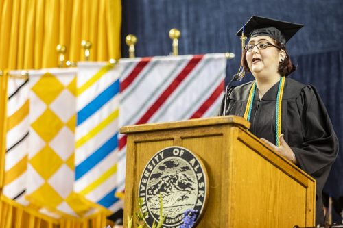 Class speaker Jessica K. Obermiller, who earned a bachelor's degree in anthropology, speaks during the University of Alaska Fairbanks' 97th commencement ceremony at the Carlson Center on May 4, 2019.