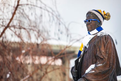 The statue of Charles Bunnell sports its blue and gold spirit. UAF photo by JR Ancheta.