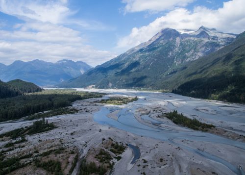 Photo by Chris Sergeant. The Tulsequah River winds through the mountains in British Columbia near the leaking Tulsequah Chief Mine. The Tulsequah River is a tributary of the Taku River, which flows into the marine waters of Southeast Alaska just south of Juneau.
