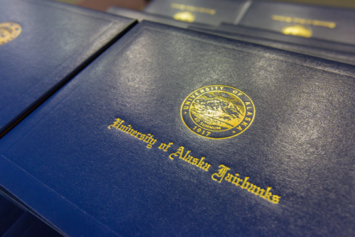 close-up of a UAF diploma cover