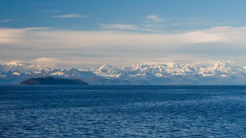 Photo by Andrew McDonnell. Mountains surround the Gulf of Alaska in this view from a scientific research ship. A new tool is available to understand ocean acidification in the gulf.