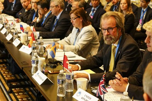 Photo courtesy of the Swiss Federal Institute for Forest, Snow and Landscape. Konrad Steffen, wearing glasses and a yellow tie, speaks at the White House in 2016, where he represented Switzerland at the Arctic Ministerial Conference.