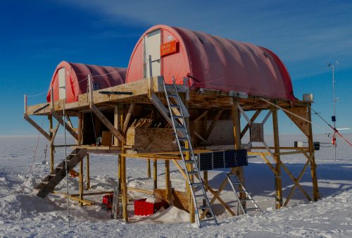 Photo by Konrad Steffen. Swiss Camp sits elevated above the Greenland ice sheet.