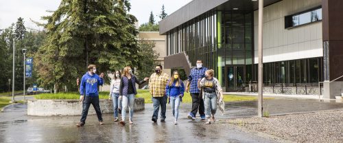Students mask up as they leave Wood Center in late summer 2020. UAF photo by JR Ancheta.