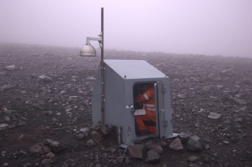 Alaska Volcano Observatory photo by Cyrus Read. Guy Tytgat in a seismic-station hut near Pavlof Volcano in 2007.