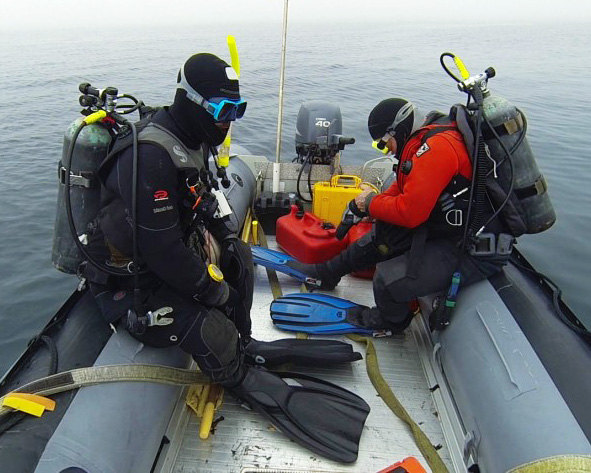 Photo by E. Conover. Divers prepare for underwater sampling in the remote Aleutian archipelago.