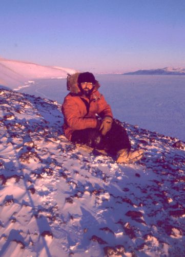 Michael Castellini in Antarctica, sitting on an island overlooking Castellini Bluff, sometime in the 1990s. Photo courtesy of Michael Castellini.