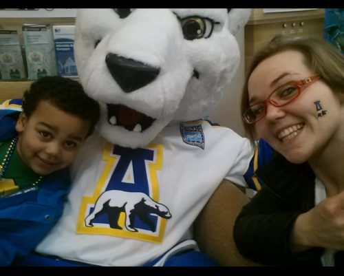 Photo courtesy of Michaella Perez. Perez and her son, Zi, have some fun with 'Nook, UAF's mascot.