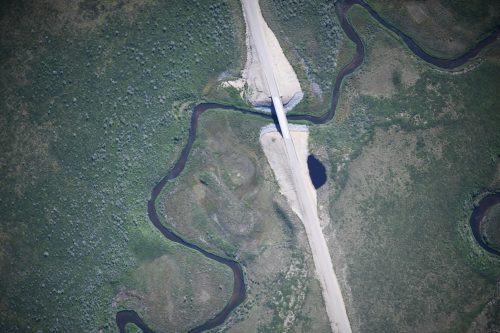 Photo by Fisheries and Oceans Canada. The SeaHunter unmanned aerial aircraft took several thousand high-resolution photographs of the new Inuvik–Tuktoyaktuk Highway in the Northwest Territories, Canada, as part of a recent mapping project.
