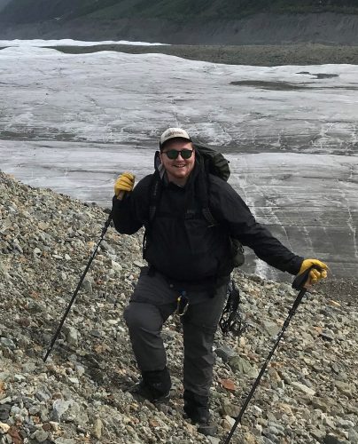 David Harvey conducts fieldwork near a glacier. Photo courtesy of the UAF Biomedical Learning and Student Training program.