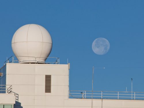 UAF photo by Todd Paris. The “Big Dog” antenna is housed in a dome atop the Akasofu Building on the University of Alaska Fairbanks campus. The antenna is one of two that are used to receive VIIRS data from two polar-orbiting satellites.