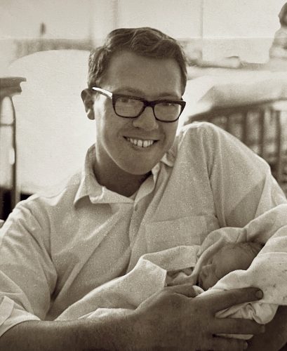 Photo courtesy of Kris Brown. Neal Brown holds his newborn son, Kris, in 1967.